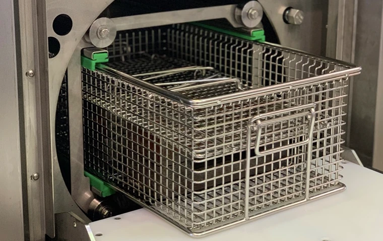 Stainless steel parts basket suitable for industrial spray cleaning.