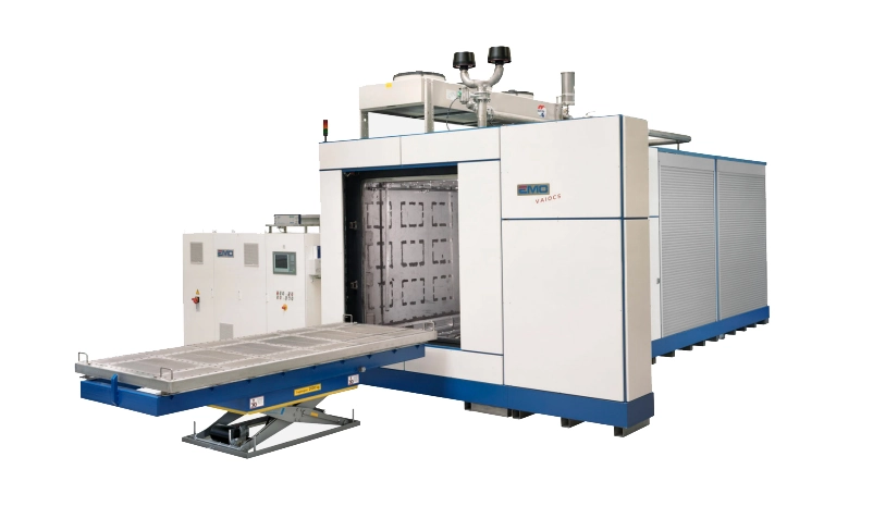 Industrial vacuum degreasing system for aeronautical components, featuring a motorised loading table.
