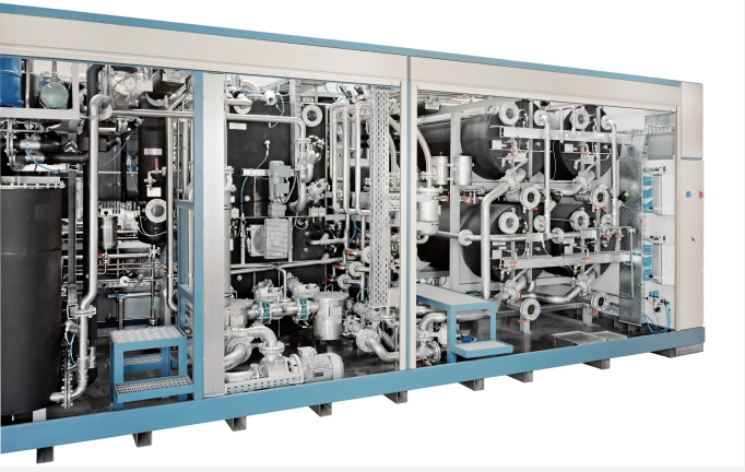 Technical interior view of an industrial cleaning machine with filtration and solvent circuits.